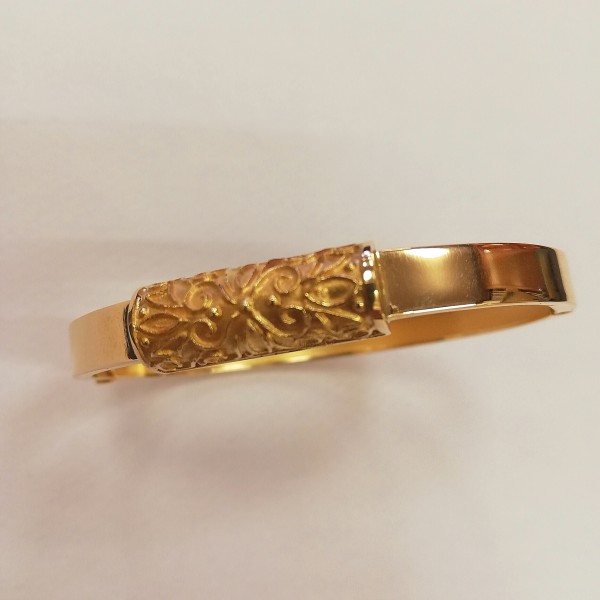 bracciale rigido lucido con decoro, apribile